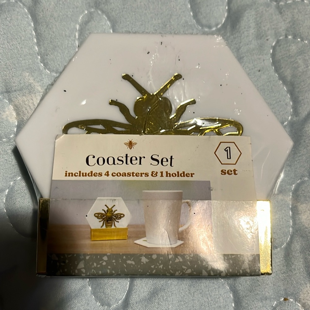 Four Coasters in holder. NEW IN WRAP
